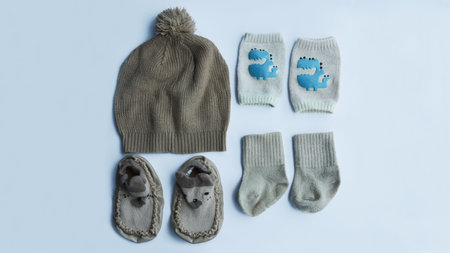 Complete brown baby fashion accessories from knitted hat, socks, knee pad socks, and shoes isolated...