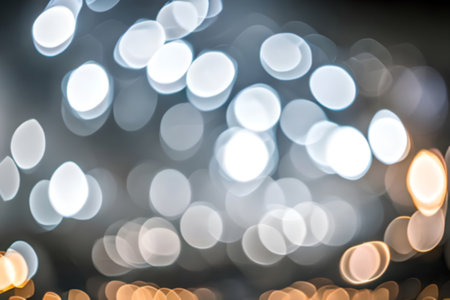 Blur or bokeh abstract lot of lighting at night background. Out of focus dreamy busy night life effect.の写真素材