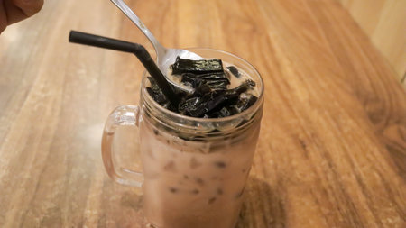 Ice milk cincau is a traditional cold beverage from Indonesia or iced grass jelly with milk and brown sugar.の写真素材