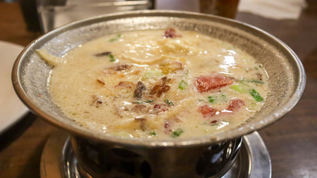 Indonesian oxtail soup is rich broth from beef tails, found globally. Variations include Korean, Chinese, Indonesian sop buntut, UK's rich gravy, and Creole tomato based version.の写真素材
