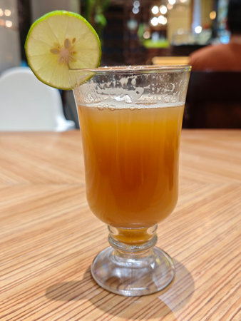 Golden Temulawak Herbal Drink in Glass, Authentic Indonesian Beverage