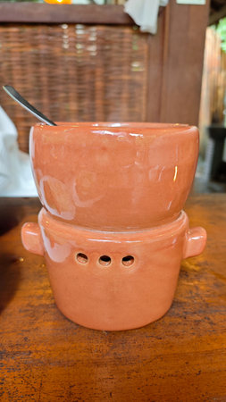 Ceramic Terracotta Kitchenware for Keeping Food Warm with Soup in Rustic Restaurant Setting