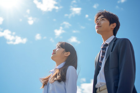 business man and woman in the blue sky. asian japaneseの素材