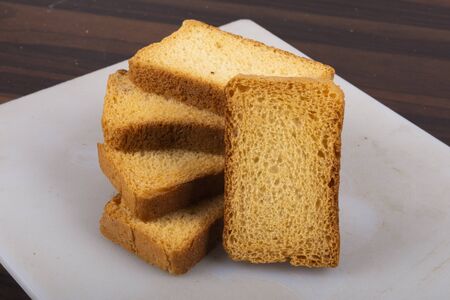 isolate milk toast or suji rusk with wood texture 