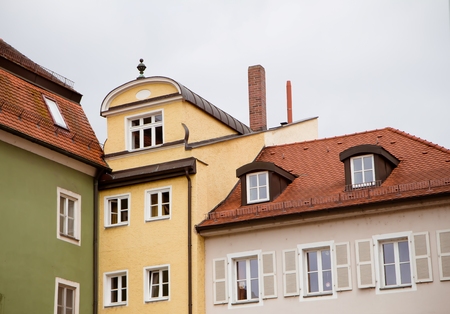 Walls, roofs and windows of typical German town buildings in Regensburg,の写真素材