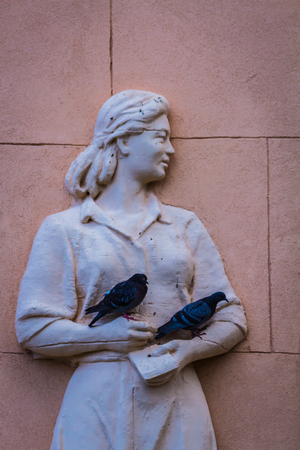 Moscow, Russia - July 21, 2018 - statue of an Central Asia woman worker on a wall of a pavillion in VDNKh exibition parkのeditorial素材