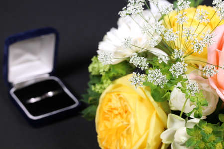 Bouquet of roses and marriage ringの写真素材