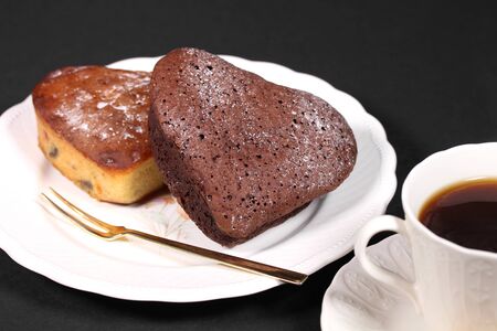 Homemade heart cake and cup of coffeeの写真素材