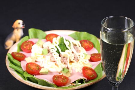 Wine and salad with tunaの写真素材