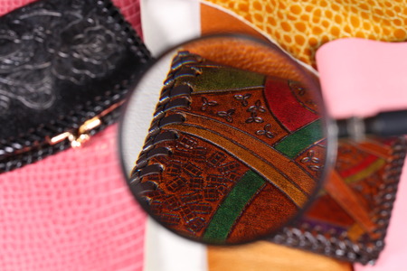 Leather wallets and magnifying glassの写真素材