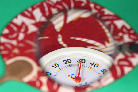 Thermometer and magnifying glassの写真素材