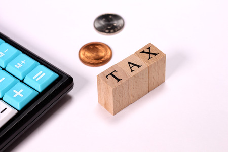 Tax calculation image, calculator and coinsの写真素材