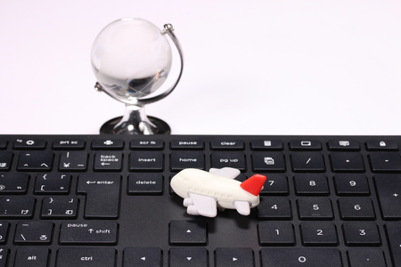 computer keyboard and globe and airplane.letter is japanese abc.の写真素材