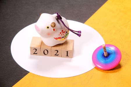 New Year's image, ox figurine and wooden topの写真素材