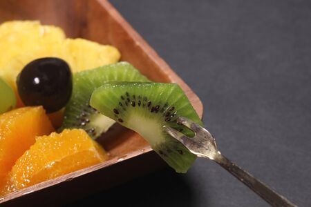 Eating Cut fruit on a plateの写真素材