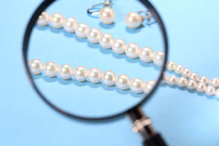 Pear Necklace and Earrings and 
magnifying glassの写真素材