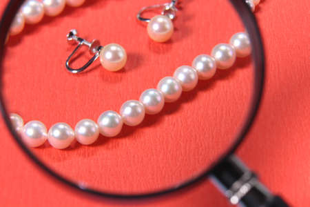 Pear Necklace and Earrings and 
magnifying glassの写真素材