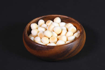 "tamago bolo" japanese egg soft biscuits in a wooden bowlの写真素材