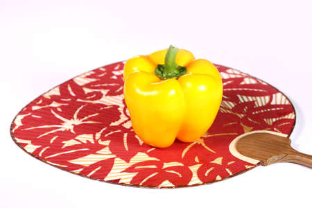 Sweet yellow pepper, paprika on the japanese fanの写真素材