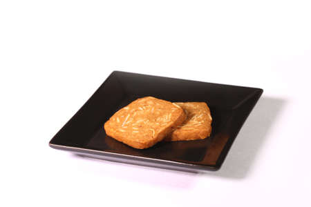 Almond cookies on a plate on white backgroundの写真素材