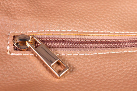 Zipper on brown leather bag close upの写真素材