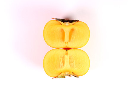Cross section of seedless persimmon fruit close upの写真素材