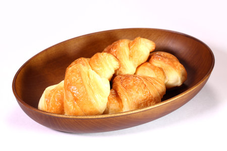 Mini homemade croissants on a trayの写真素材