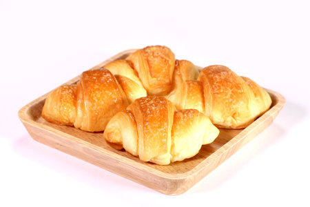 Mini homemade croissants on a trayの写真素材