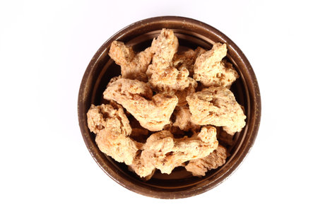 Dry soy meat in a small bowl on white backgroundの写真素材