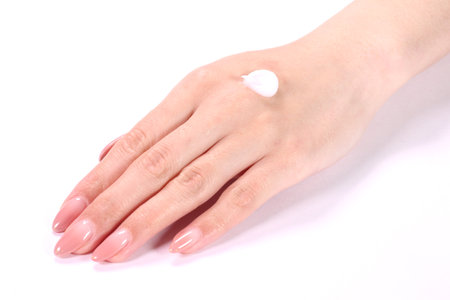 Female hand with hand creamの写真素材