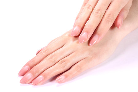 Beautiful female hands with pink manicure on white background, closeupの写真素材