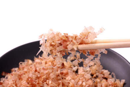 Dried bonito with chopsticks, close upの写真素材