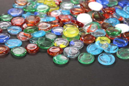 Colorful glass marbles on black backgroundの写真素材