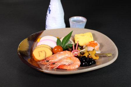 Japanese cuisine, New Year dishes OSECHI (Osechi ryori) with sake.の写真素材