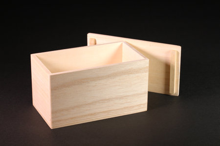Paulownia wooden box on black backgroundの写真素材