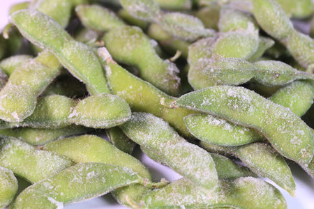 Frozen boiled Edamame (green soybeans) on white background, close upの写真素材