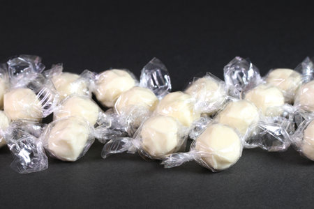 Plural candy cheese on black backgroundの写真素材