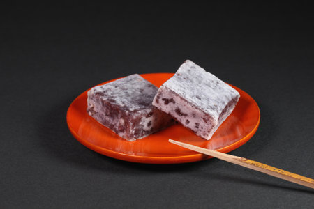 Japanese sweets Kintsuba on a plate. Kintsuba is  sweetened red  beans wrapped in wheat flour dough.の写真素材