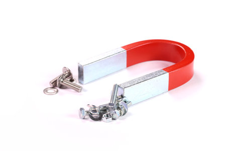 U shaped magnet, bolt and nut on white backgroundの写真素材