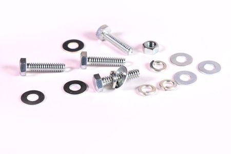 Bolts, nuts and washers on white backgroundの写真素材
