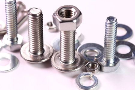 bolts, nuts and washers on white backgroundの写真素材