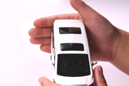 Child's hands holding a mini carの写真素材