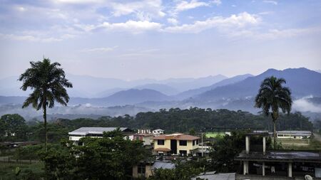 neighborhoods characteristic of the amazons in ecuador. you can see the mountains full of vegetation and the morning fogの写真素材