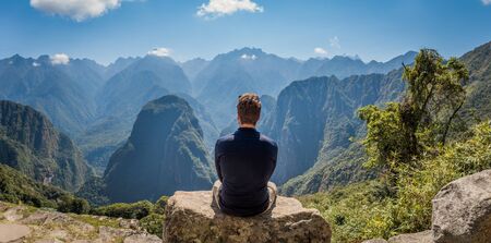 A man staring at the amazing landscape of Machu Picchu.の写真素材