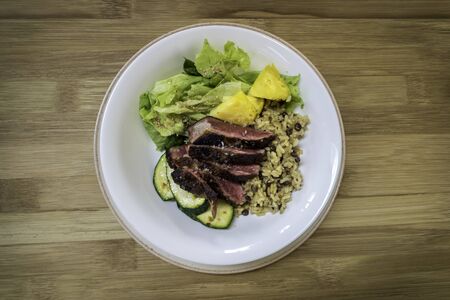 Succulent meat dish with salad, grilled vegetables and rice. Organic food. Top viewの写真素材
