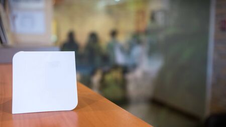 Blank flayer to complete by adding brand, phrase, text. Unfocused meeting room background with peopleの写真素材