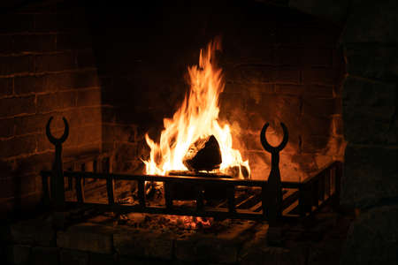 Old and antique fireplace at night. Close upの写真素材