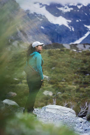 Young woman on the mountain. Hooker Valley track in Mount Cook National Park. New Zealandの写真素材