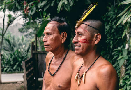 Indigenous kichwa men from Ecuador wearing traditional ornaments. February 2018. Puyo, Amazonia, Ecuador.のeditorial素材