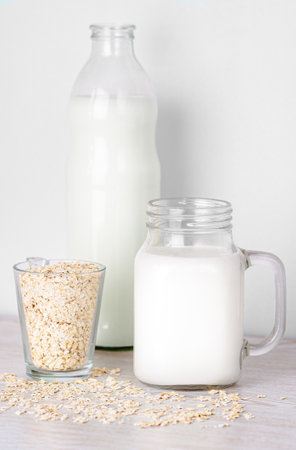 Fresh oat milk close up. Lactose free, vegan concept. portrait photoの写真素材